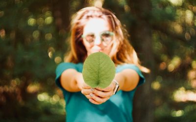 woman holding leaf